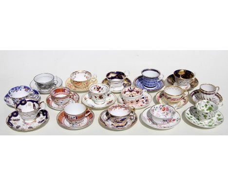 A quantity of late 18th / early 19th century porcelain cabinet cups and saucers to include Royal Crown Derby examples.