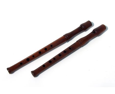 A fruitwood recorder, serial no. 6799, 30cms long; together with another similar, serial no. 3718 (2).Condition ReportBoth ha