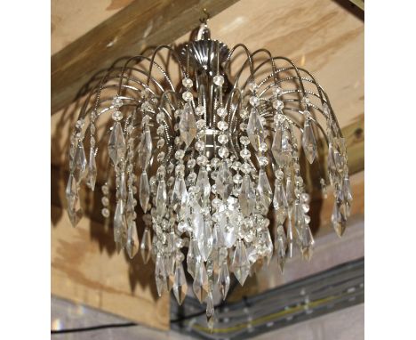 A silver plate and crystal drop ceiling light.