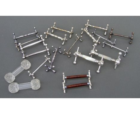 A large quantity of silver plated and other knife rests.