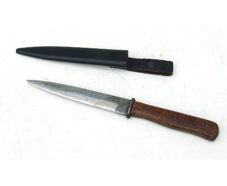 A WWI trench knife with a 14.5cm (5.75 ins) blade in it's steel scabbard