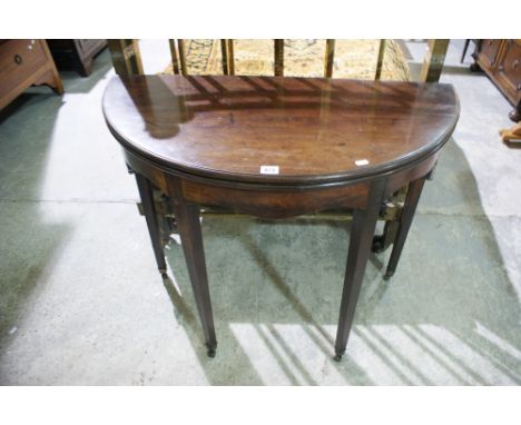 A 19th Century Mahogany Fold-Over Card Table On Tapered Supports