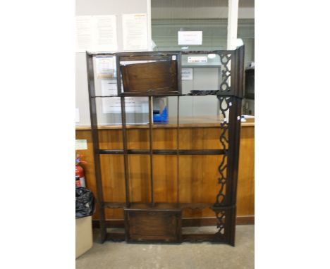 An Oak Four Shelf Wall Rack With Two Side Cupboards