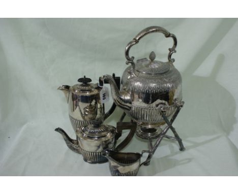 An Oval Based Three Piece Plated Tea Service Together With A Plated Spirit Kettle On Stand