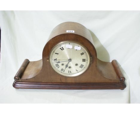 A Polished Mahogany Mantel Clock With Circular Silvered Dial