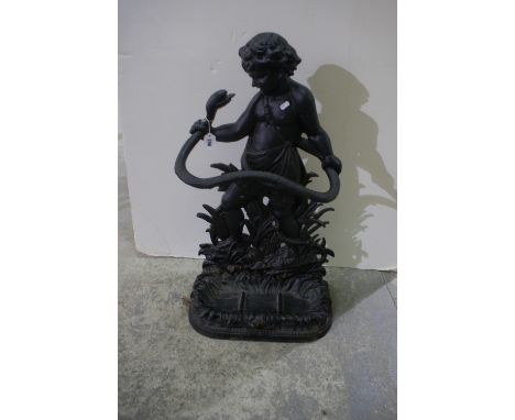 A Cast Iron Stick Stand In The Form Of Cherub And Serpent