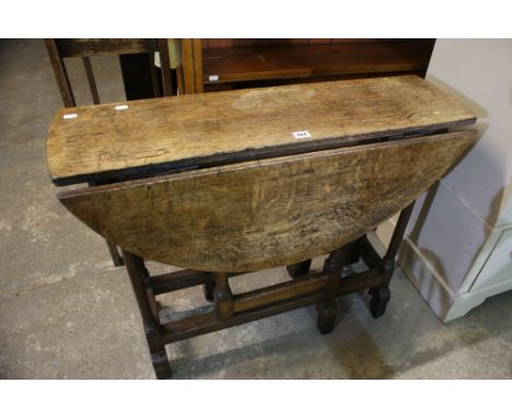An Antique Oak Gate Leg Table On Block And Turned Stretchers