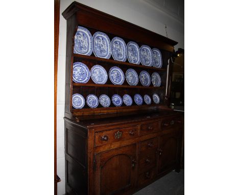 A 19th Century Oak Welsh Dresser Having A Three Shelf Rack (Reduced) The Base Having Two Side Cupboards Each With Drawer Abov