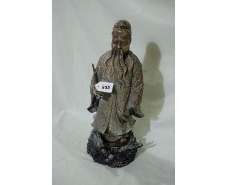 An Oriental Cast Brass Figure Of A Sage Holding A Pipe 18" High