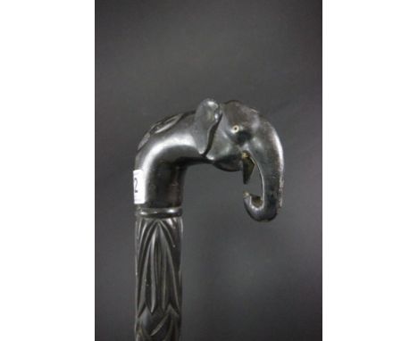 Ebony walking stick with elephant head handle and twisted carved decoration to stem