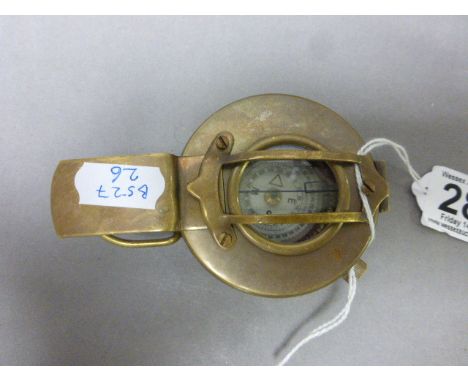 Brass compass stamped TG Co Ltd London 1940 with crows foot mark