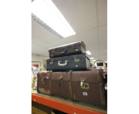 A trunk and two vintage suitcases