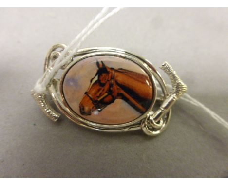 Silver and enamel set brooch depicting a horse