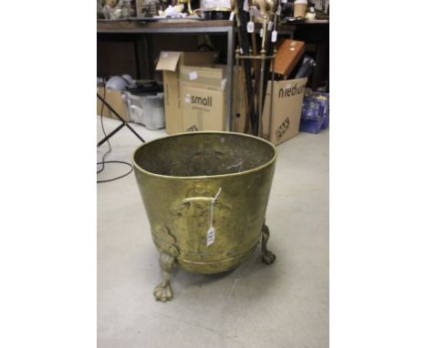 Vintage brass log basket on tripod paw feet