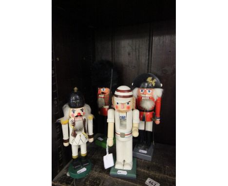 Four vintage Erzgebirge wooden nutcrackers to include; cricketer and military figures