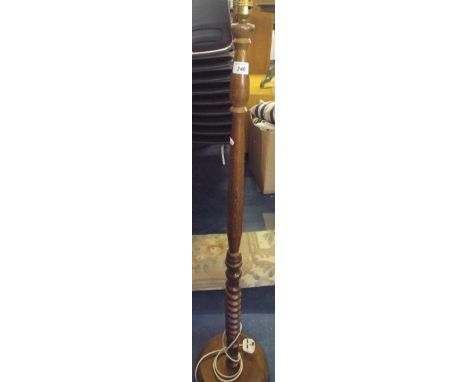 A Short Scale Wooden Standard Lamp with Barley Twist Column. 