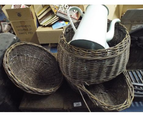 A Lidded Wicker Basket with Enamel Coffee Pots Dishes Etc Inside. 
