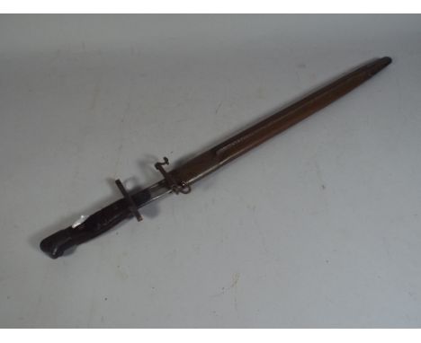 A Remington Wooden Handled Bayonet Dated 1913 Together with Leather Mounted Scabbard. 