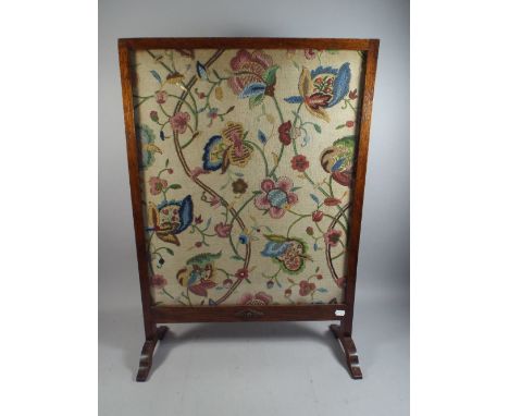 An Oak Framed Crewel Work Fire Screen. 