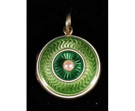 Edwardian circular enamel pearl set gilt locket with suspension ring. 25mm CONDITION REPORT: No obvious losses to the enamel
