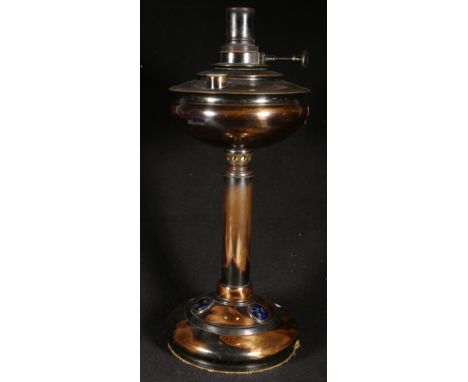 Arts & Crafts patinated brass "Veritas" oil lamp with inset enamel plaques to circular base, 43cm high