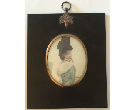 Silhouette portrait miniature of a woman in late 18th century dress, oval, in an ebonised frame with oak leaf and acorn finia