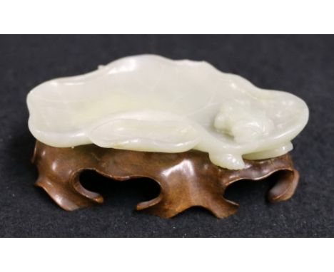 Chinese early 20th century carving of a frog on a lily pad in mottled grey / green celadon jade with a carved wooden stand CO