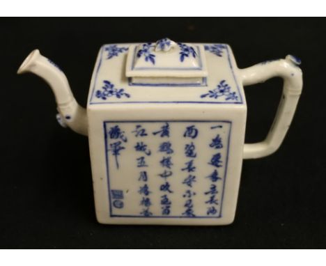 An interesting 19th century Chinese teapot of rectangular section with simple handle, the domed lid with flower-head knop, ca