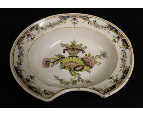 19th century French faience bleeding bowl decorated with cornucopia and vase of flowers, initialled MG in blue enamel, 27cm w