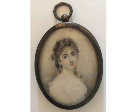 An early 19th century portrait miniature on ivory of a woman in a white dress, gilt brass oval frame with suspension loop, 5c