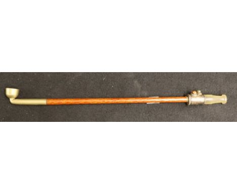 Tibetan pipe with lacquered stem, jade mouthpiece and coral and hardstone cabochon decoration CONDITION REPORT: Mouthpiece no