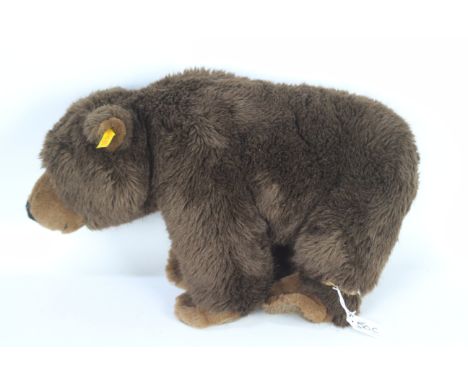 Steiff - A Steiff brown plush bear #069833. The bear measures approx 30cms (H) x 50cms (L) and comes with Steiff button and y