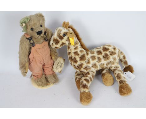 Steiff - An unboxed Steiff #110405 Giraffe approx 32cms (H) with Steiff button and yellow tag to ear; together with an unboxe