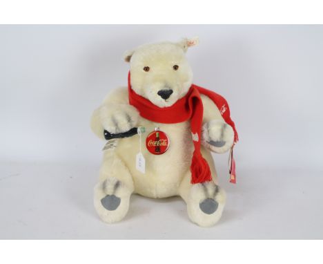 Steiff - An unboxed Steiff Limited Edition Coca Cola Polar Bear. The mohair bear wearing red scarf, measuring 35 cm in height