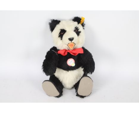 Steiff -  A Steiff #408311  1938 Replica Panda Bear approx 35cms in height, with yellow label and Steiff button to ear with s