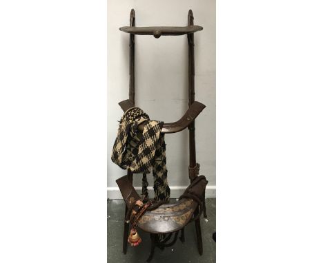 A Rajastani camel saddle, with accessories and bespoke hook 