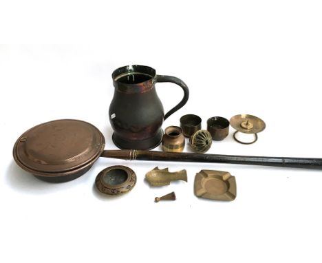 A mixed lot of metal items to include a copper pitcher; enamelled brass pot; candle holder; ashtray; bed warming pan 