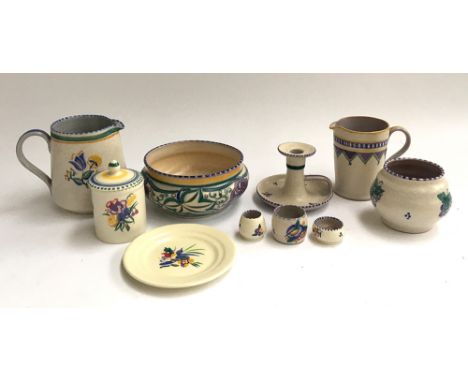 A collection of 10 pieces of Poole pottery, three pieces with Carter, Stabler Adams stamp, to include two jugs, candlestick, 