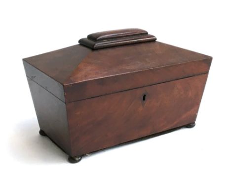 A 19th century mahogany sarcophagus tea caddy, three lidded compartments, 31cmW 