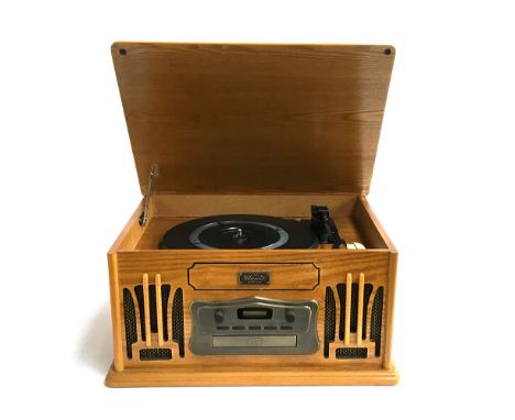 A Classic Collectors Edition record, cassette, and CD player 