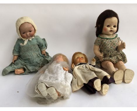 A vintage pedigree doll; a Karl Baumann doll marked 6 1/2; together with two others 