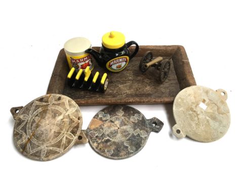 A novelty Marmite teapot; together with Marmite toast rack and storage jar; together with a wooden tray, small brass cannon a