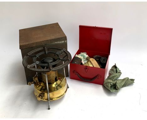 An Optimus No.5S Primus 1601 stove, made in Sweden, in a Carrs of Carlisle biscuit tin; together with a vintage brass parafin