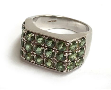 9ct white gold dress ring decorated with green stones, gross weight 10.3g 