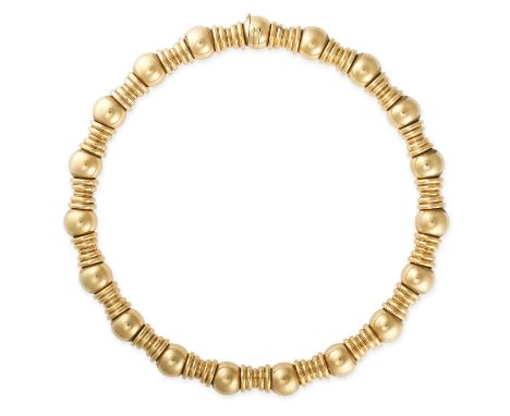 BOUCHERON, A VINTAGE GOLD COLLAR NECKLACE Series of alternating spherical and fluted beadsSigned Boucheron and numbered, Fren