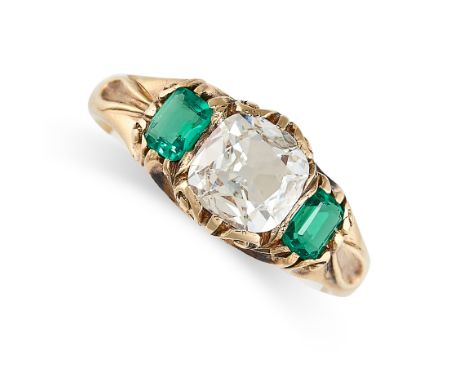 AN ANTIQUE EMERALD AND DIAMOND RING, LATE 19TH CENTURY Cushion shaped diamond, approximately 0.60 carats Step-cut emeralds, a