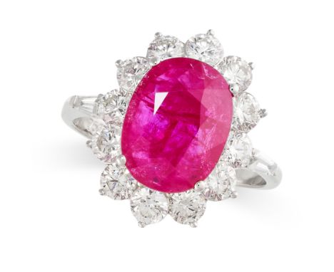 A RUBY AND DIAMOND CLUSTER RING Oval ruby, 3.90 carats Brilliant-cut and baguette diamonds, 1.64 carats total Stamped 750 Siz