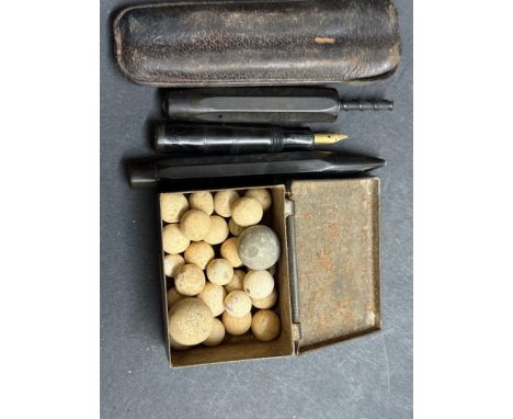 Possible stone marbles, fountain pen & ballpoint pen 