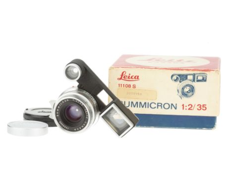 A Leitz Summicron f/2 35mm Lens, 1963, chrome, serial no. 2009968, with ocular attachment, body, VG, elements, G-VG, some int