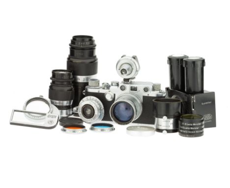 A Leica IIIc Rangefinder Camera Outfit, 1950, chrome, serial no. 518762, with Leitz Summitar f/2 50mm lens, 1948, chrome, ser